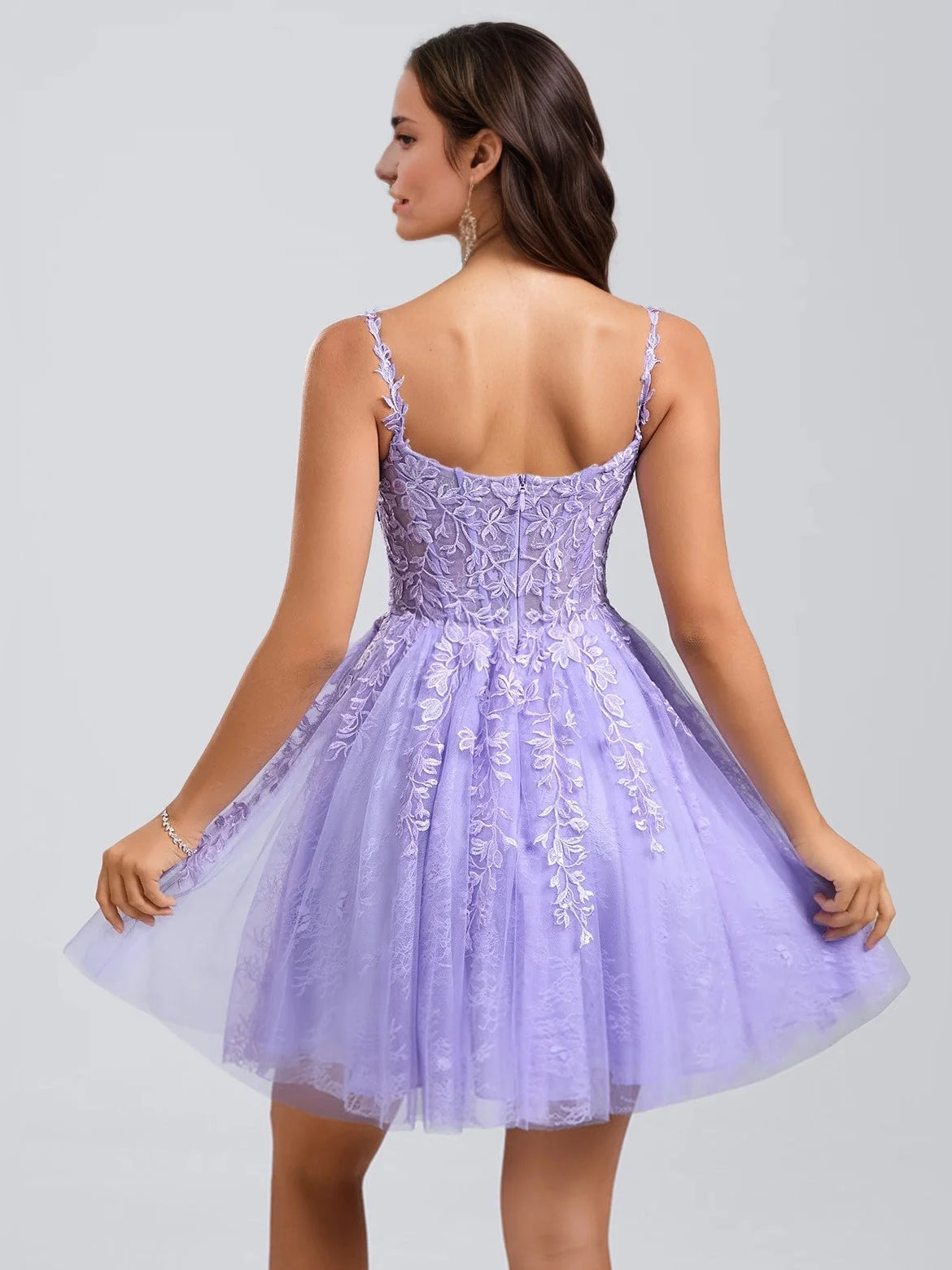 Light purple corset-style mini dress with open back straps, floral tulle skirt.