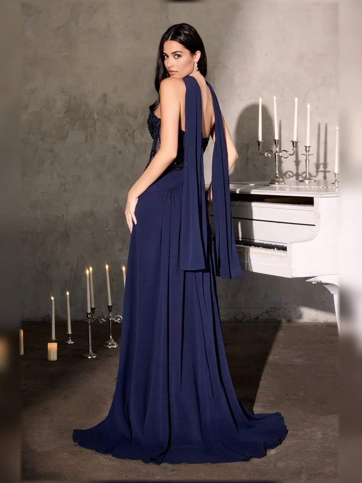 Navy strapless A-line chiffon gown with beaded bodice and draped back sash