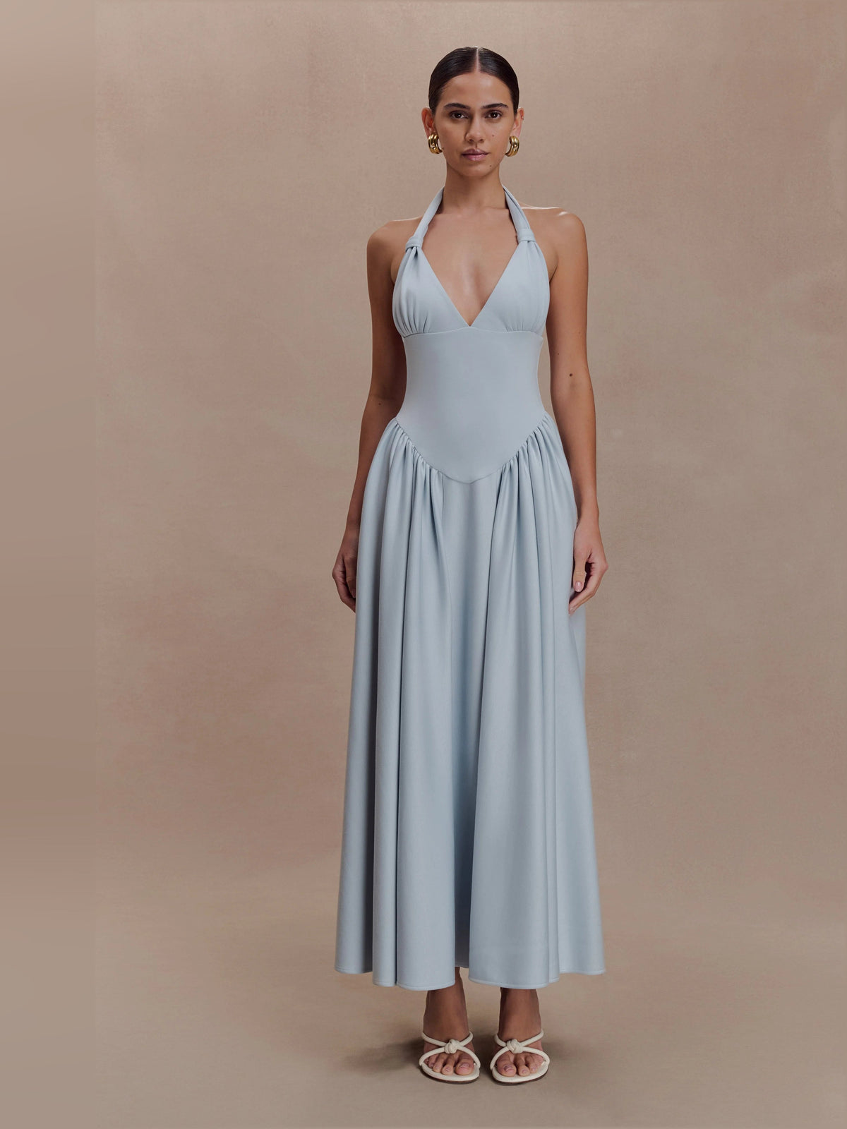 Light blue halter V-neck midi dress with draped bodice and gathered pleated skirt