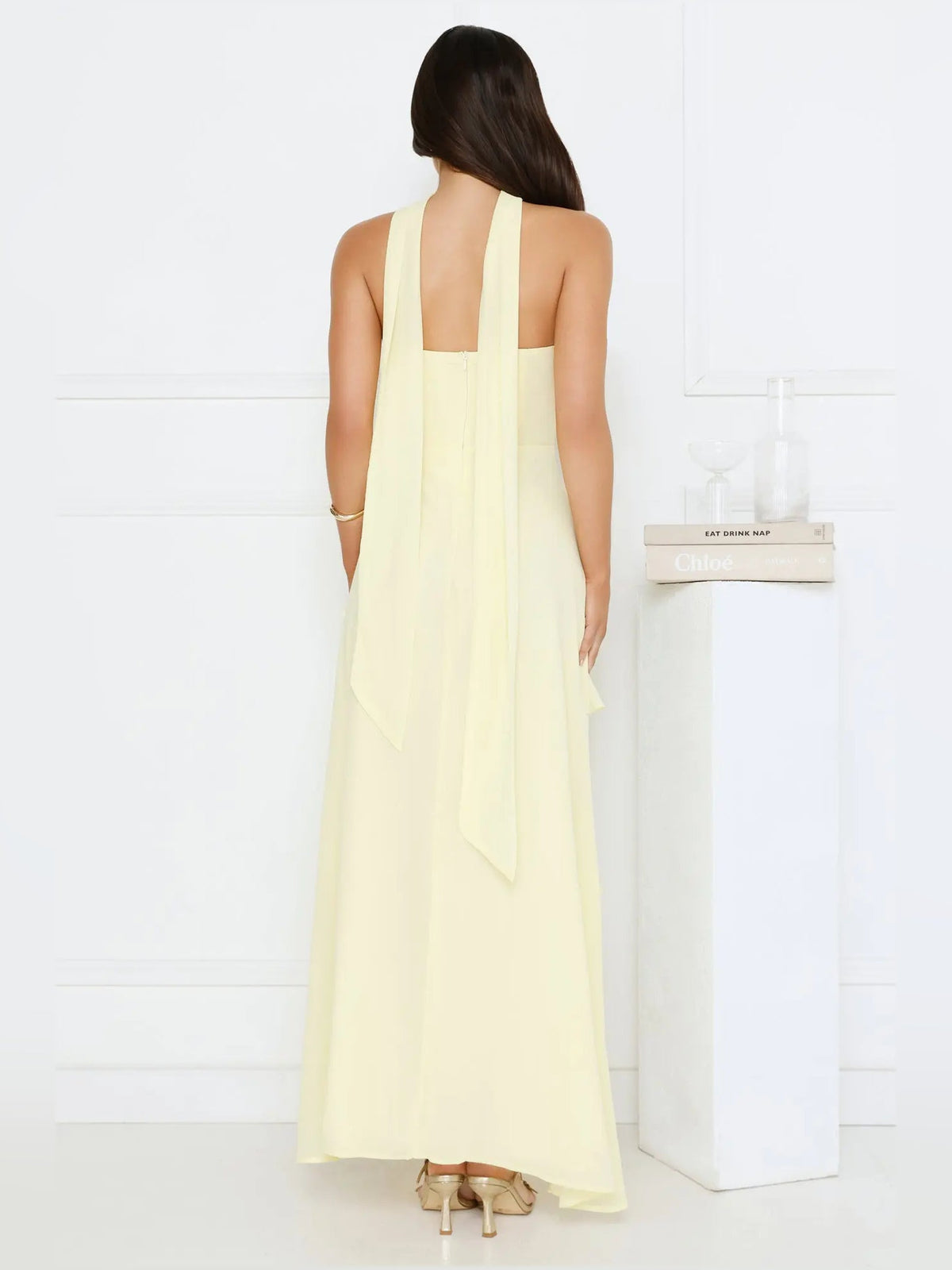 Yellow a-line maxi formal dress with tiered skirt, full-length back view