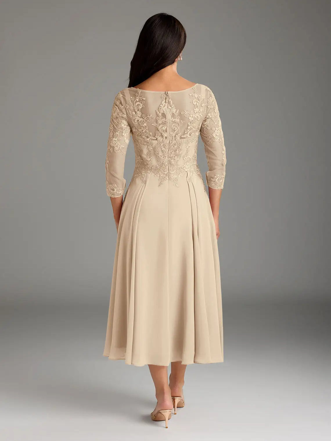 Women’s champagne midi chiffon dress, back view with lace sleeves and gathered waist