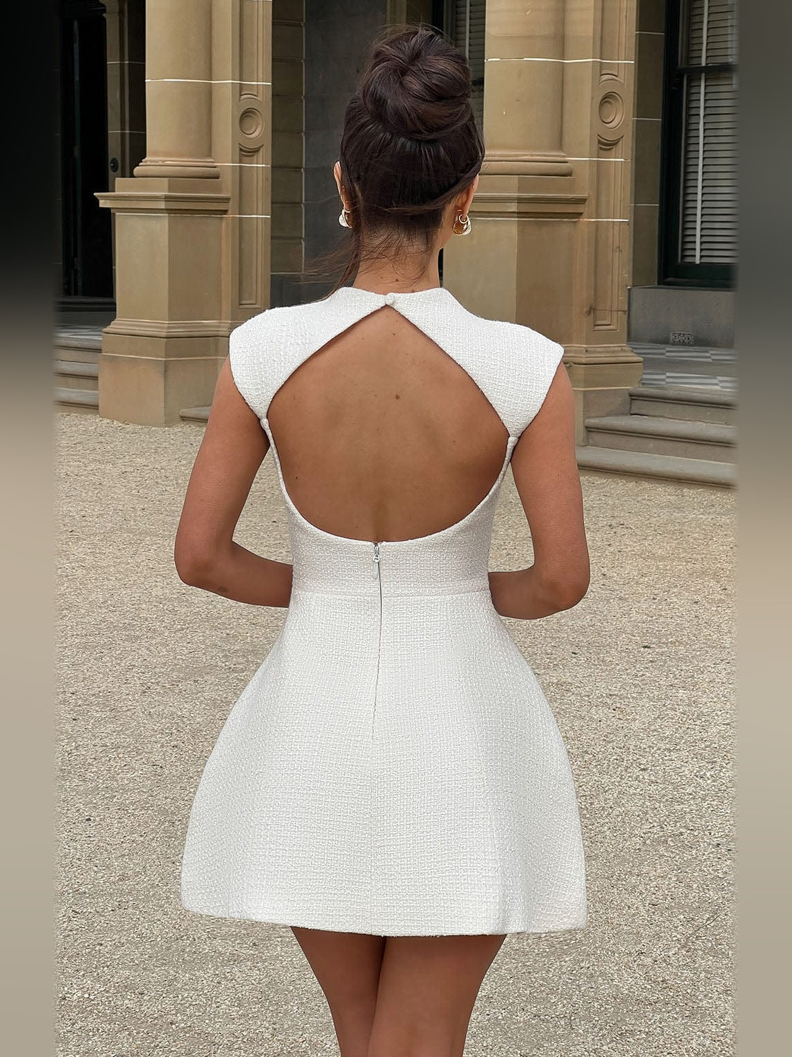 Ivory mini dress in text texture with open scoop back and sleeveless design