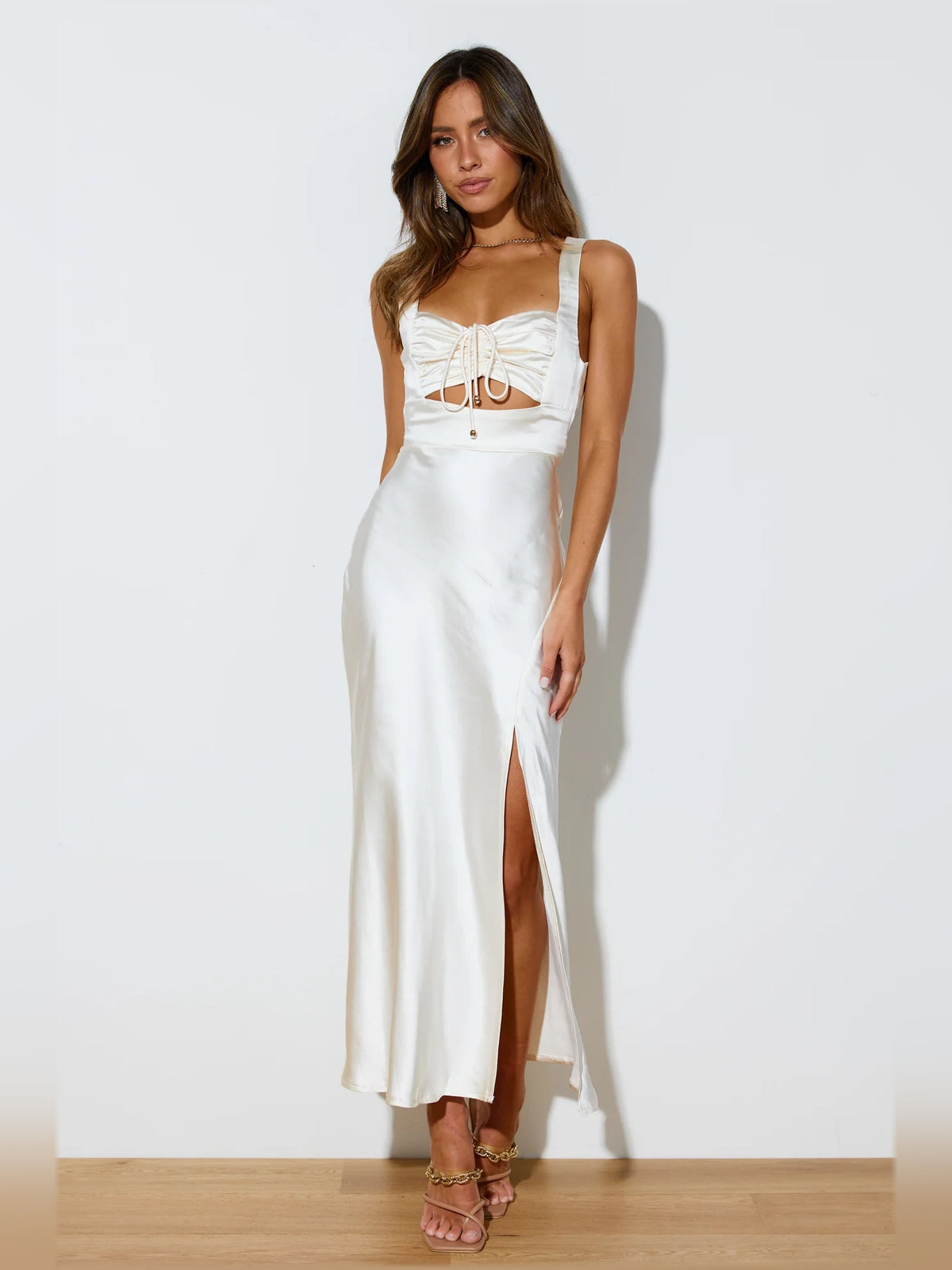 Cream satin midi formal dress with spaghetti straps, lace-up front, and side slit