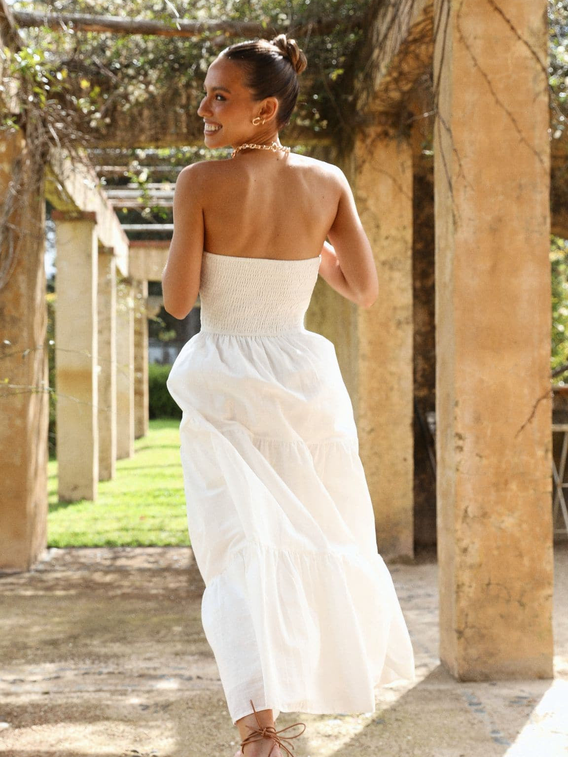 White midi formal dress, back full-length view showing the bodice