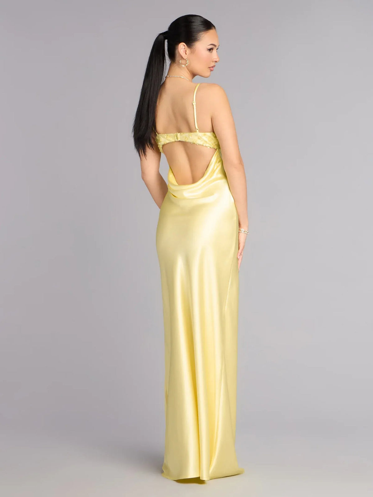 Yellow formal dress with open back, beaded spaghetti straps, floor-length