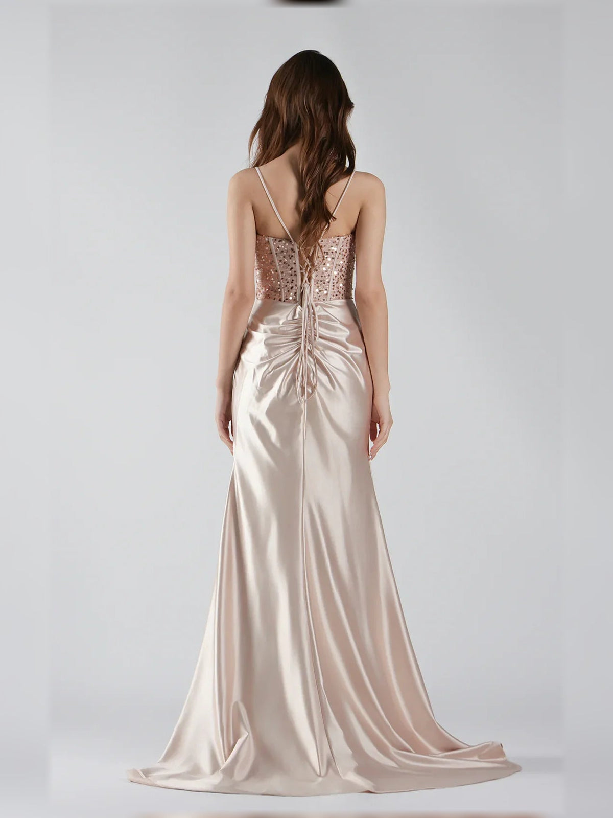 Champagne satin corset gown, back view with spaghetti straps, ruching at waist, floor length