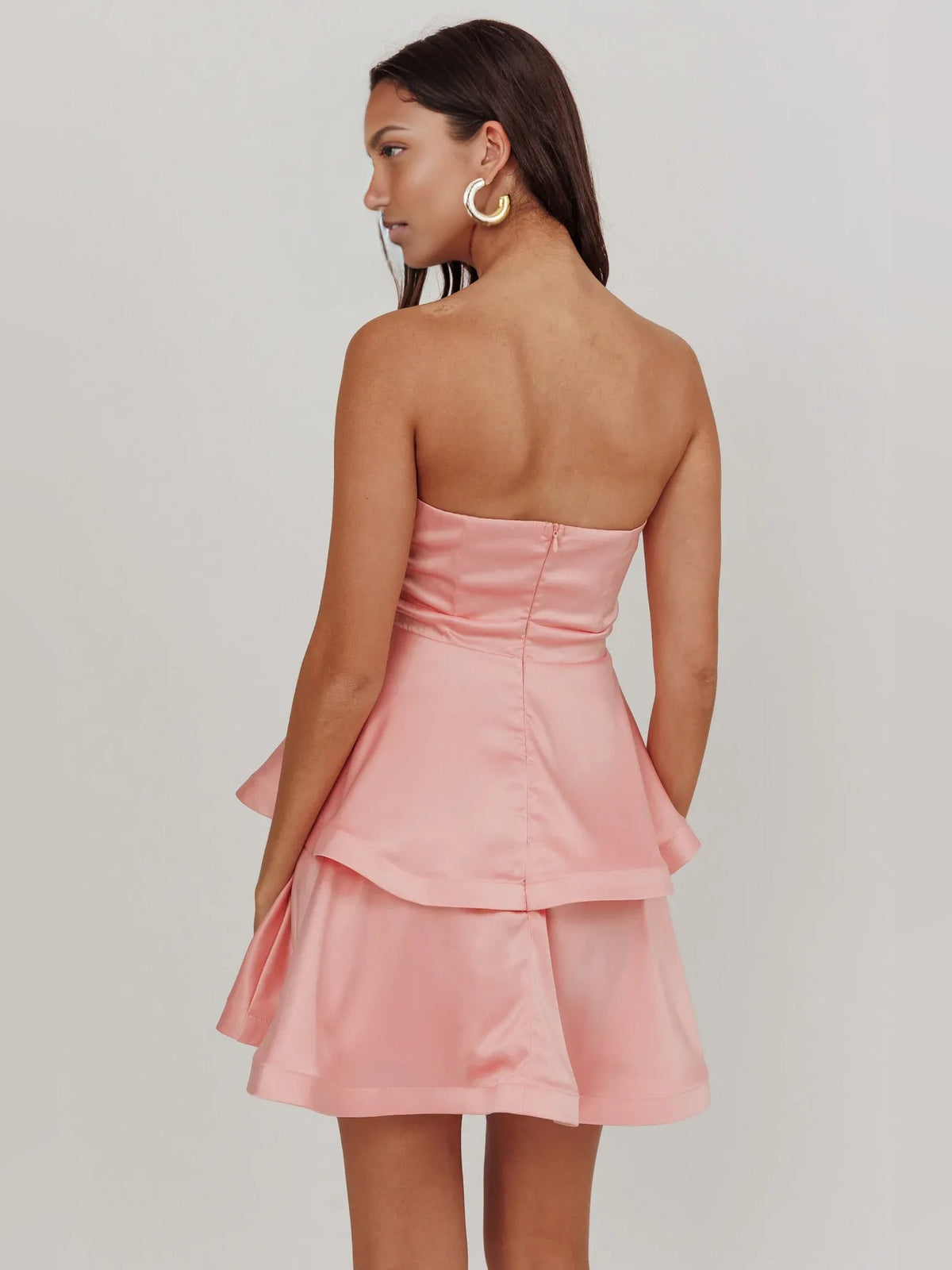 Pink strapless satin mini dress, low back with tiered ruffle skirt and waist bow