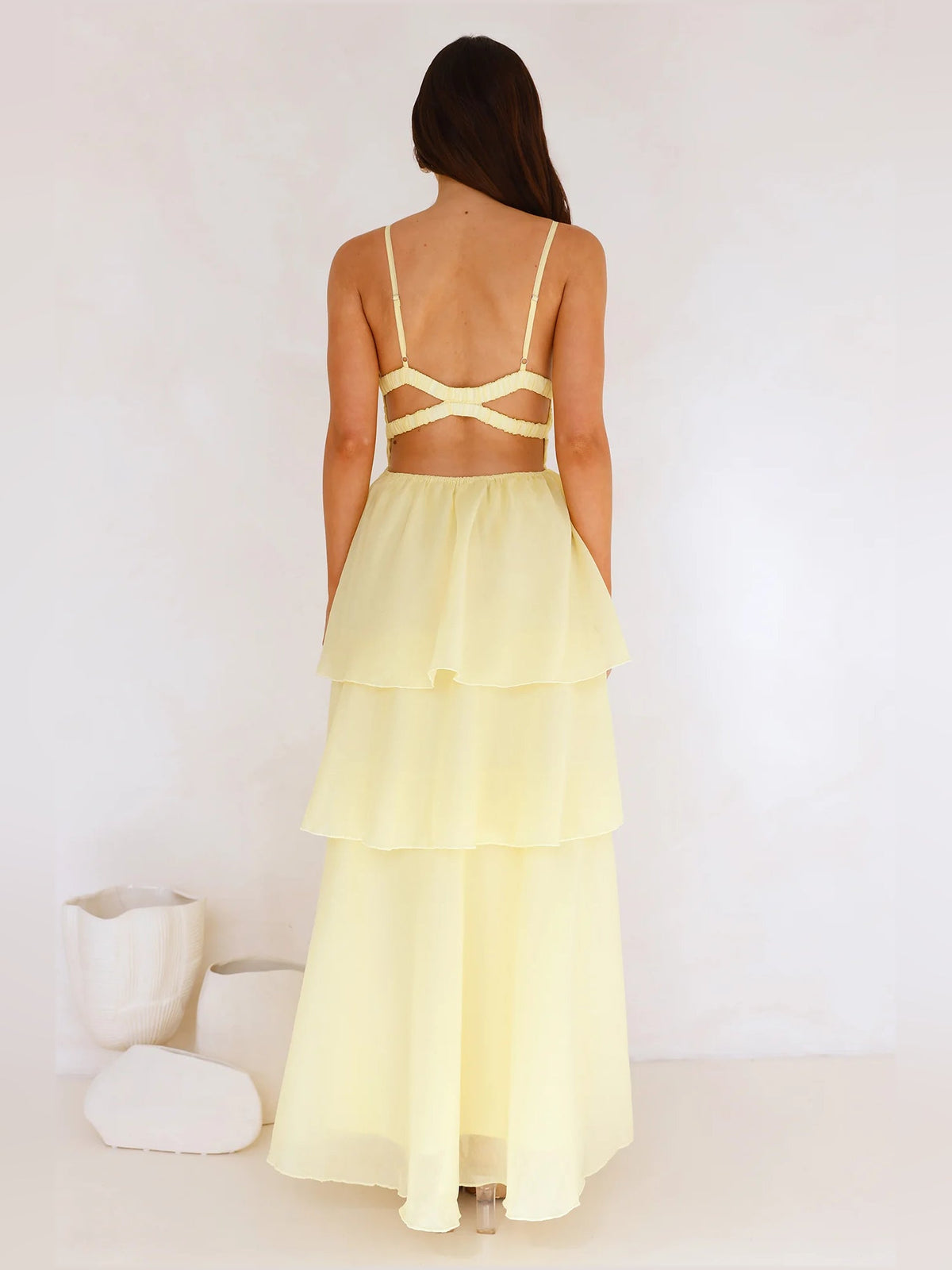 Yellow a-line maxi formal dress with tiered skirt, full-length back view