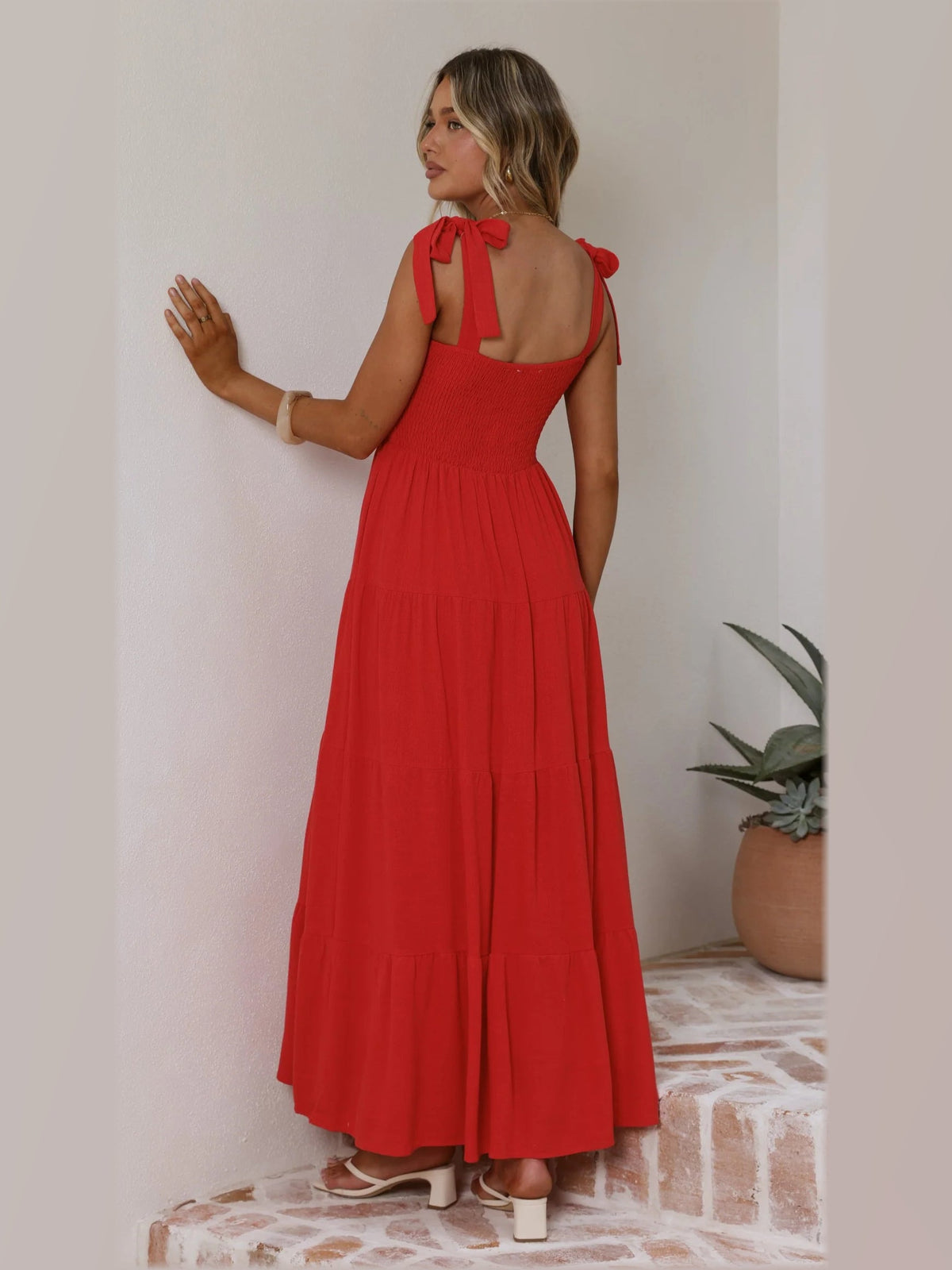 Red maxi formal dress, back full-length view showing the bodice