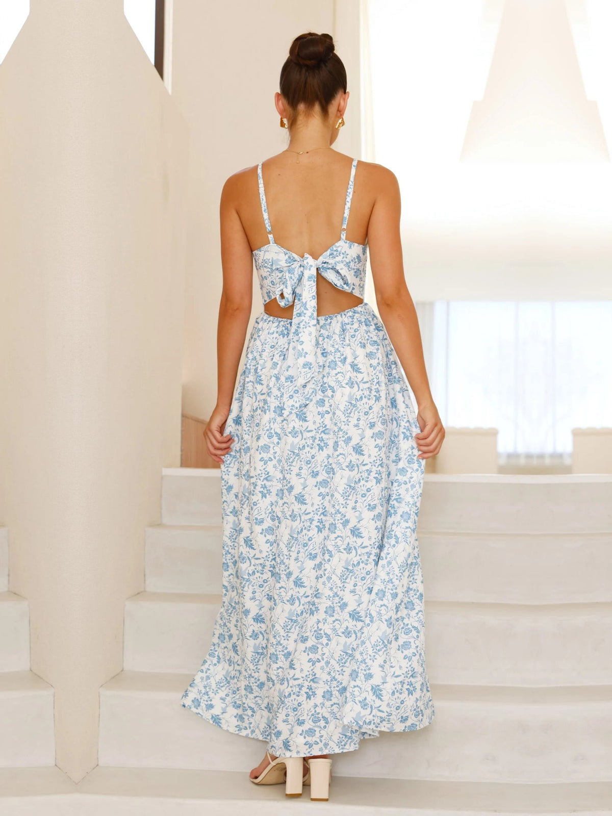 Blue Floral a-line maxi formal dress with floral print, full-length back view