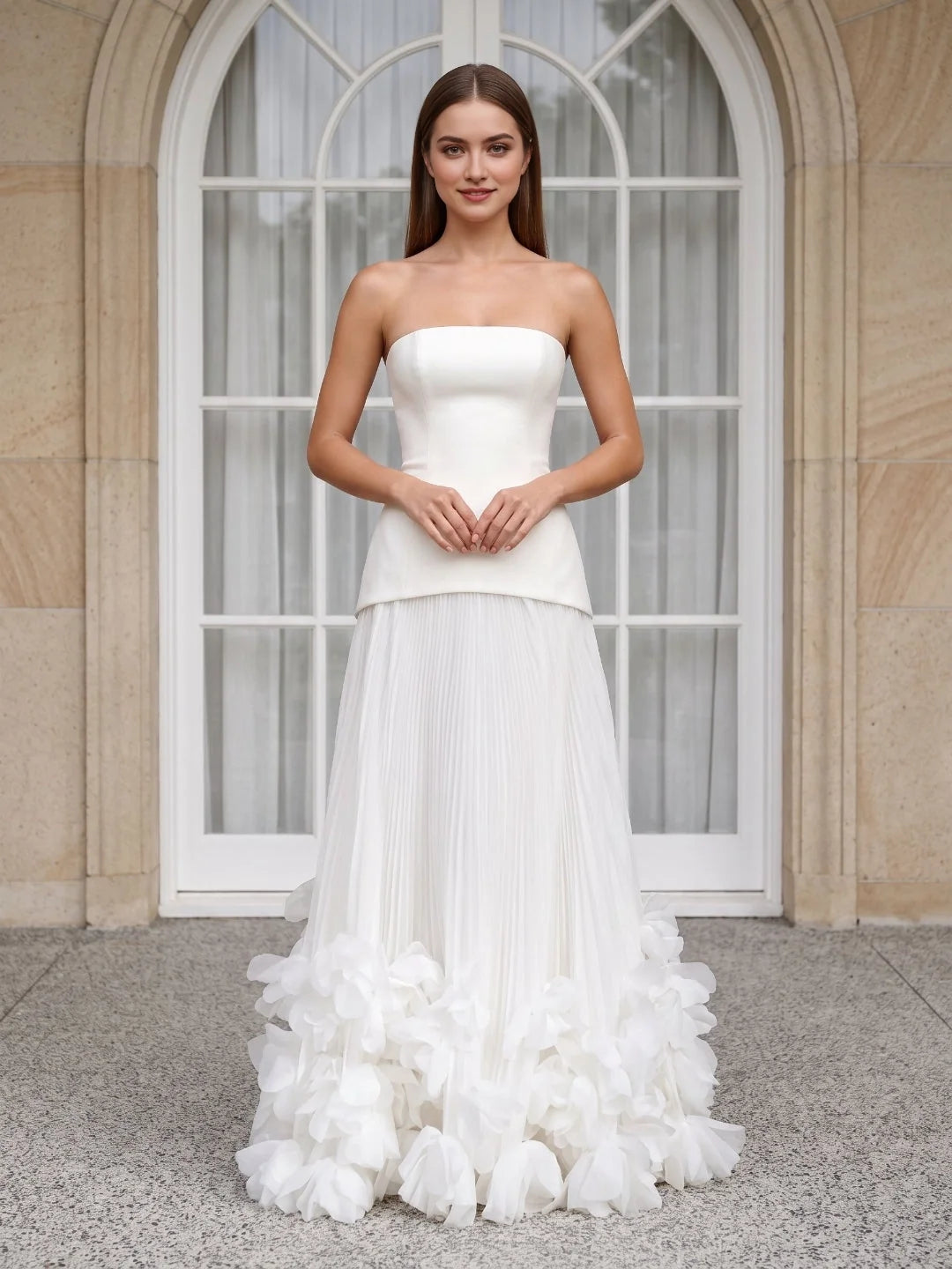 Ivory strapless wedding dress with structured bodice and ruffled A-line chiffon skirt