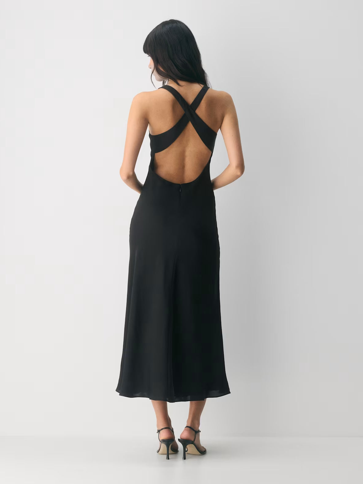 Black maxi formal dress, back full-length view showing the bodice