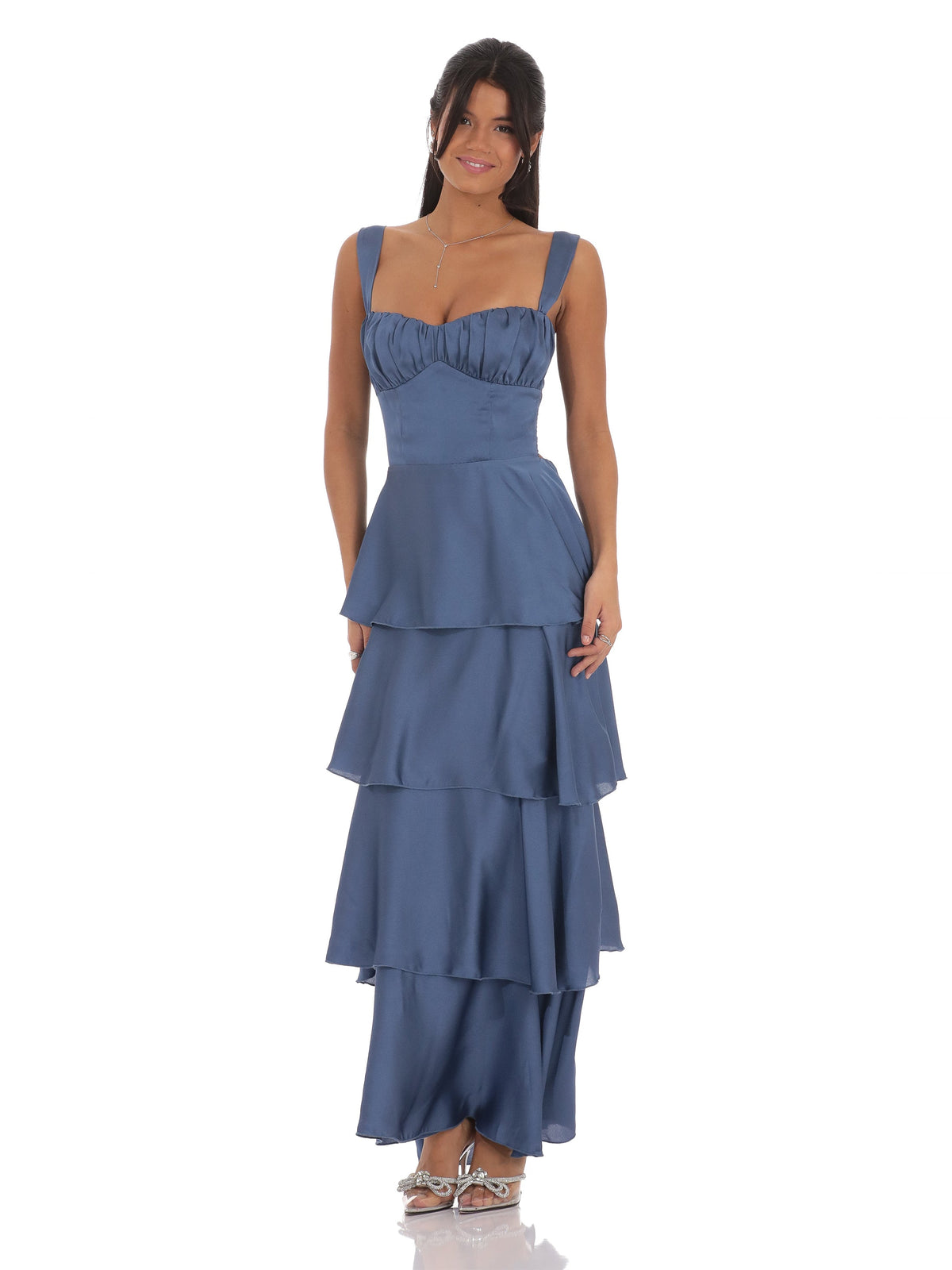 Slate blue satin maxi dress with spaghetti straps and tiered ruffle skirt.