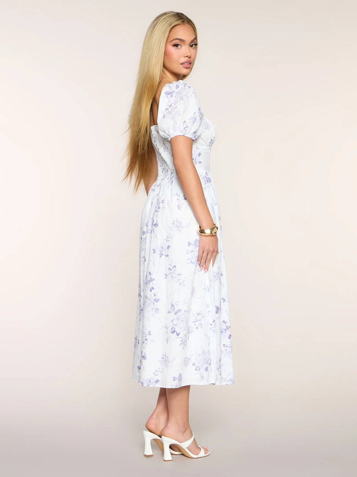 Floral midi dress with puff sleeves and square neckline, side view