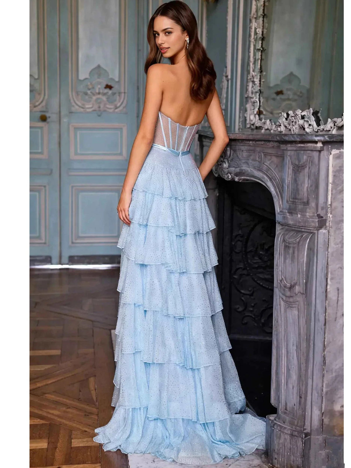 Light blue corset-style formal dress, tiered ruffle skirt with bow at waist, floor-length