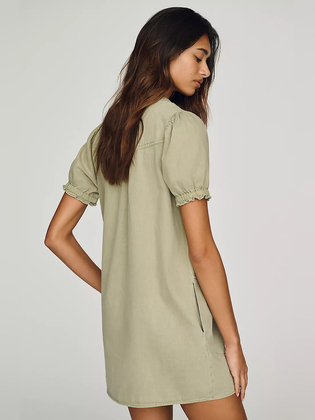 Sage mini dress side view with puff sleeves and side slit