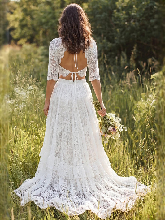 Ivory lace maxi wedding dress with open back tie and tiered ruffle skirt