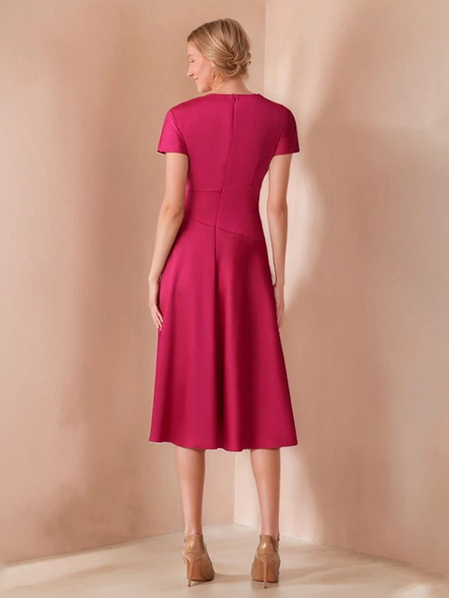 Hot pink satin A-line dress with ruched back waist, short sleeves and knee length.