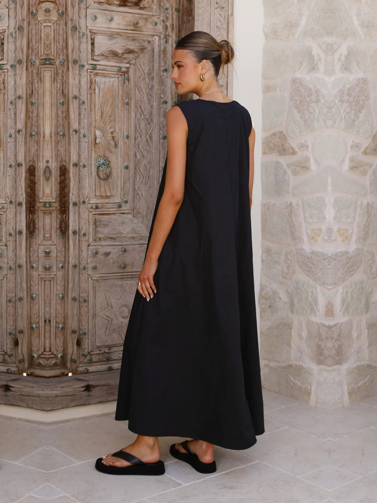 Black a-line maxi formal dress with a-line, full-length back view