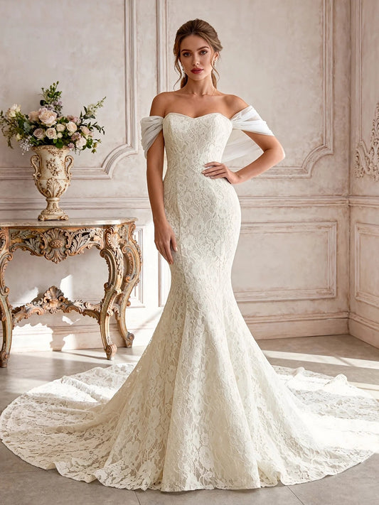 Ivory lace mermaid wedding dress with off-shoulder sweetheart neckline and draped sleeves