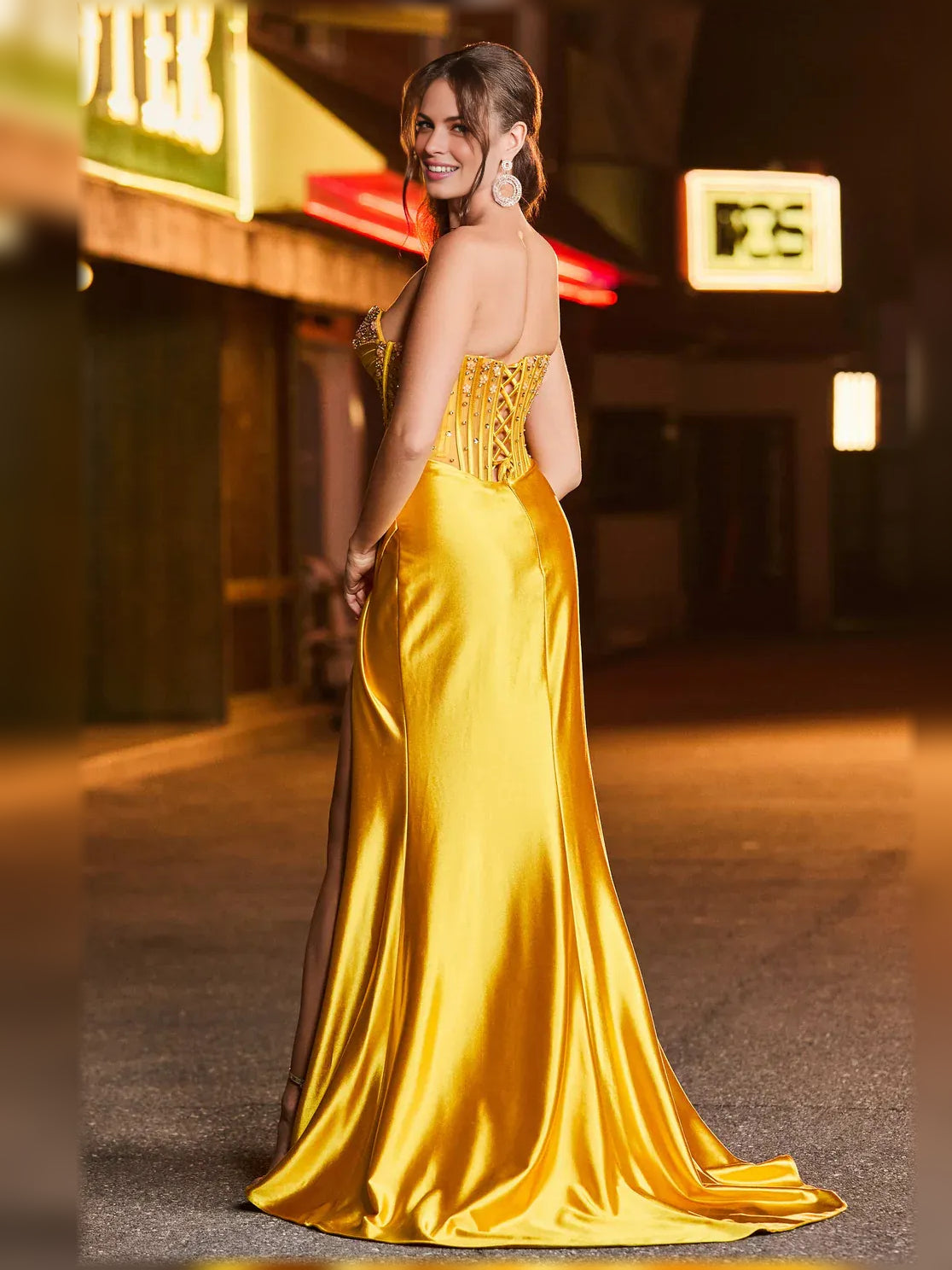 Gold strapless sweetheart corset formal dress with jeweled detailing and side slit