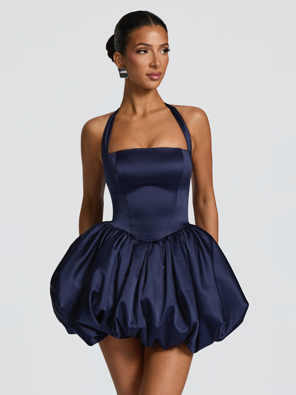 Navy mini homecoming dress with halter straps and gathered puff skirt