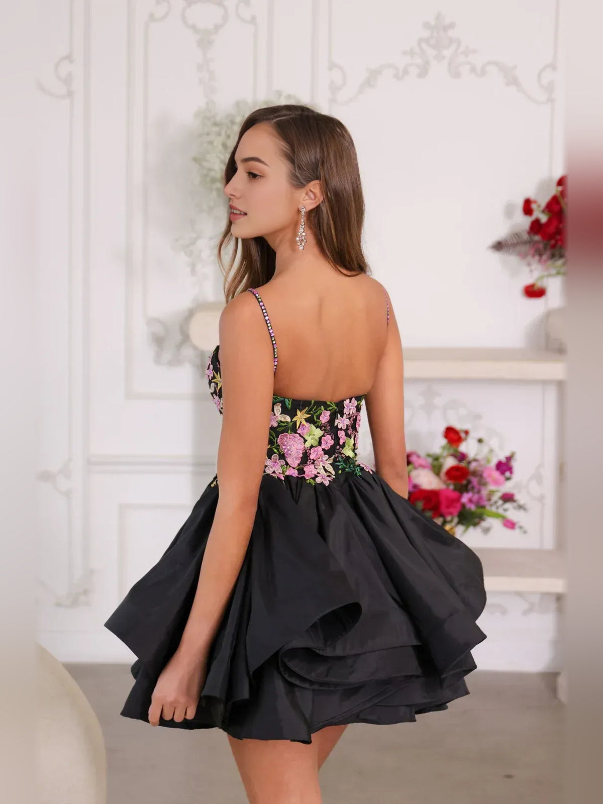 Black floral satin mini homecoming dress with sweetheart neckline and tiered ruffle skirt