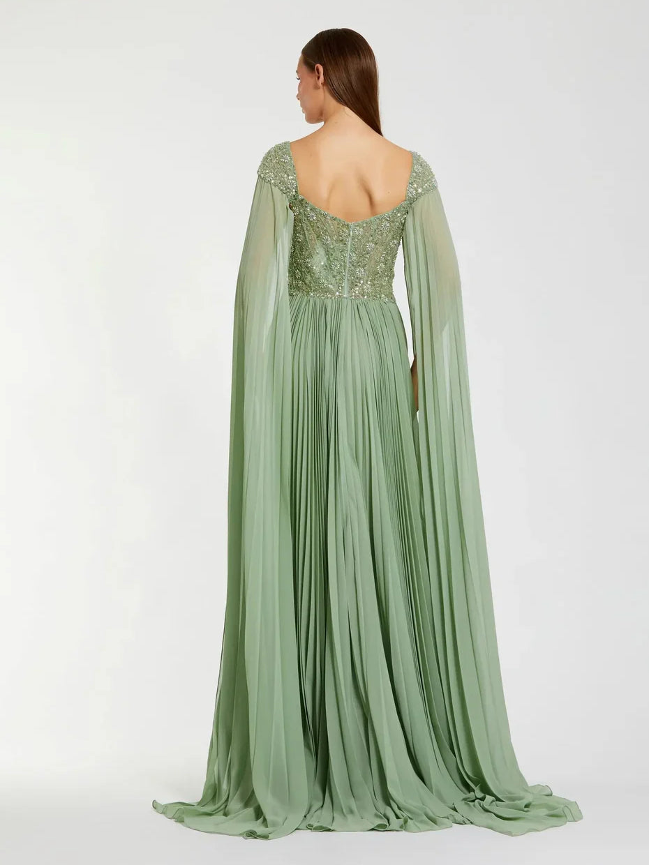 Dusty sage formal gown, pleated skirt and beaded back bodice, cape sleeves