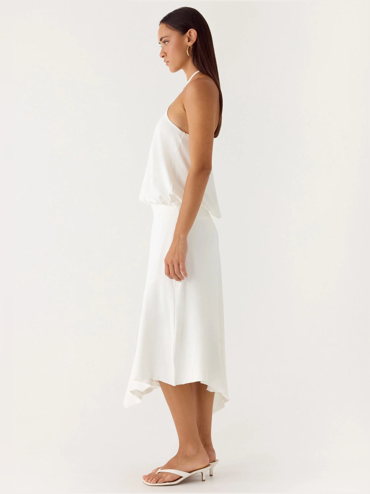White midi formal dress, sleeveless halter style with draped waist and asym hem