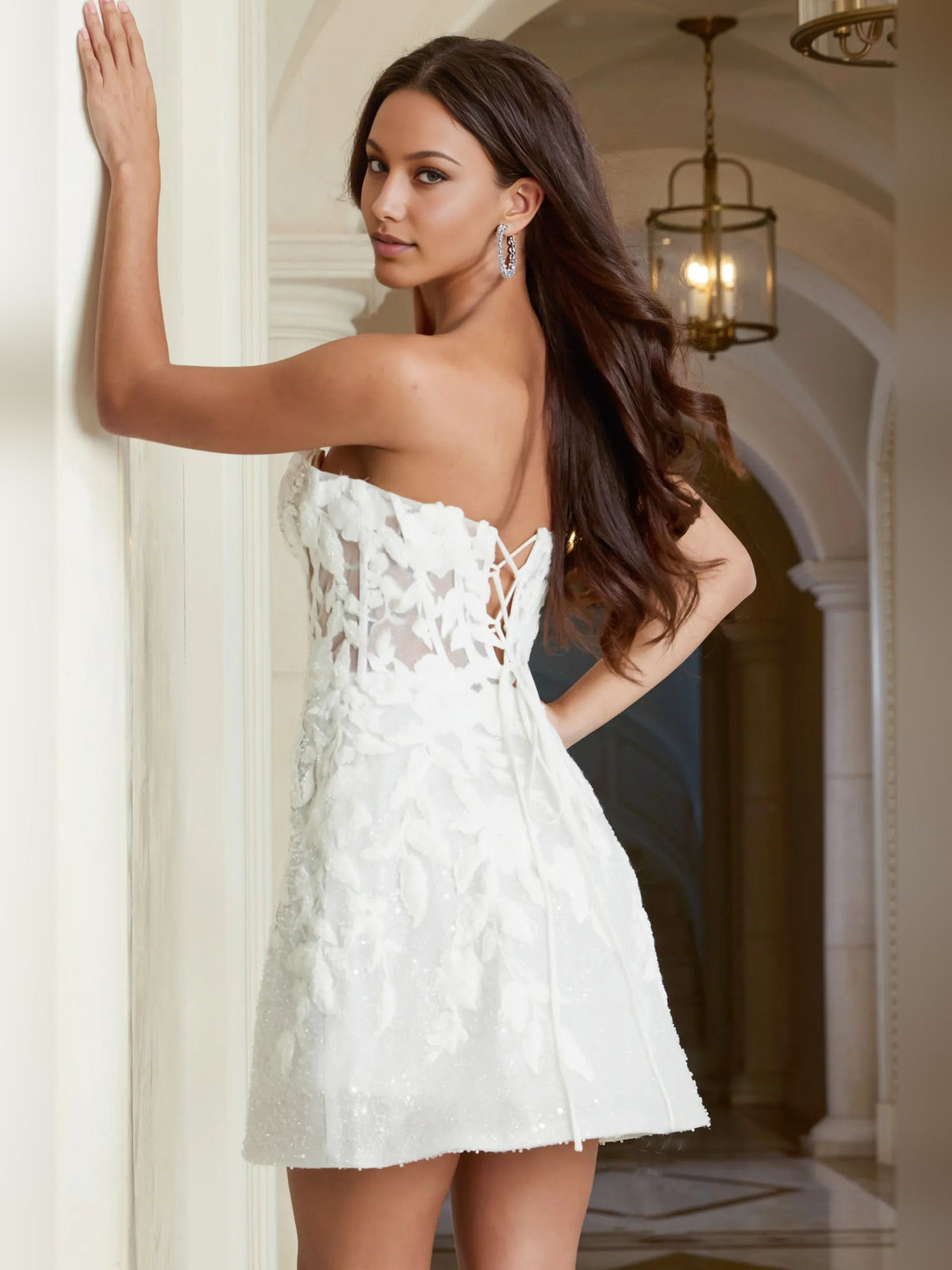 White mini dress with strapless sweetheart front and open-back lace bodice