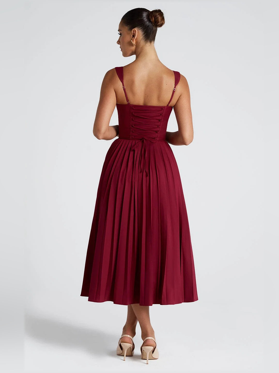 Berry midi formal dress with gathered back corset, thin straps, and pleated skirt