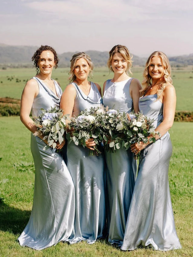 Group wearing dusty blue cowl-neck mermaid bridesmaid dresses, floor-length sleeveless