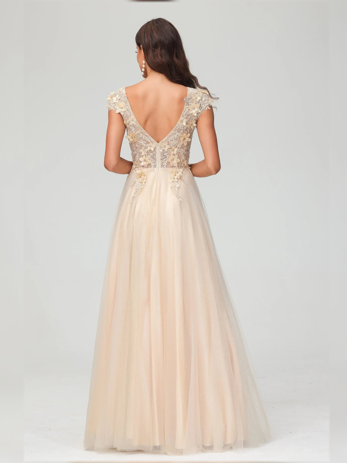 Champagne floor-length formal dress with floral appliqué, V back and cap sleeves