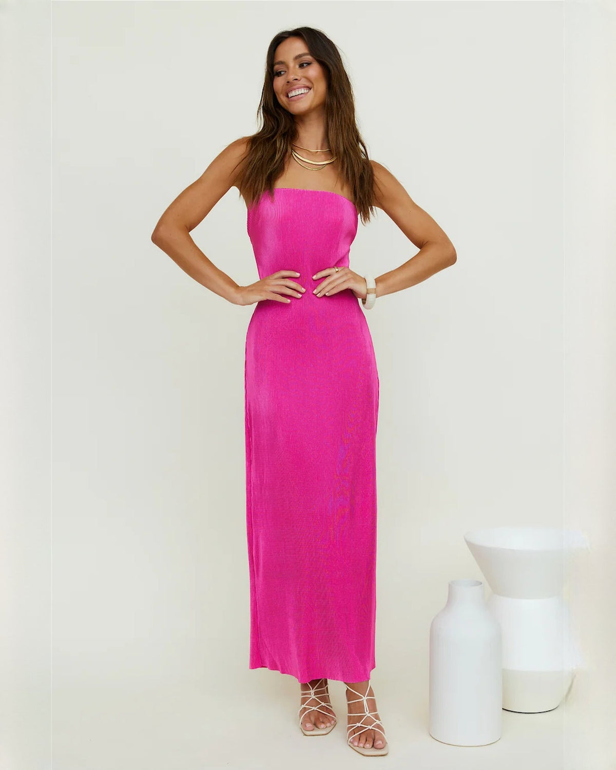 Bright pink strapless satin A-line maxi dress, fitted bodice and straight skirt