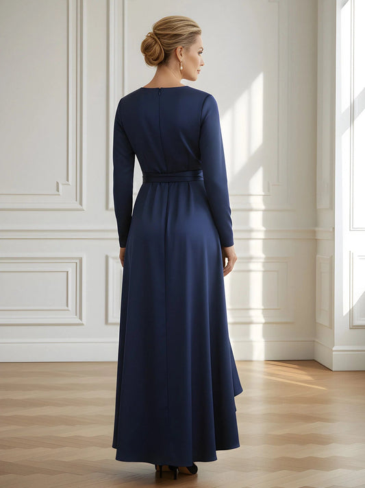 Dark navy satin sheath dress with V-back, long sleeves, and draped ruffle skirt