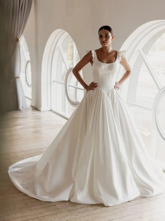 Ivory satin ball-gown wedding dress with V-neck bodice, gathered waist, full skirt