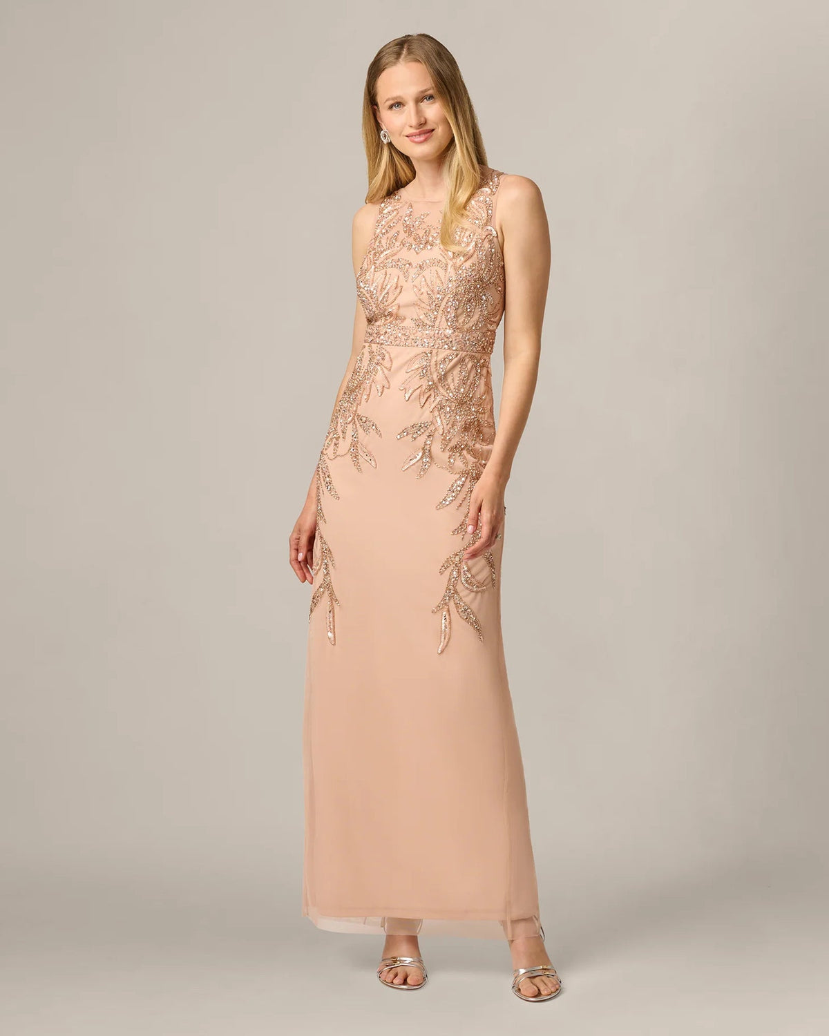 Rose gold sleeveless formal maxi sheath dress with sparkling beaded detailing on bodice