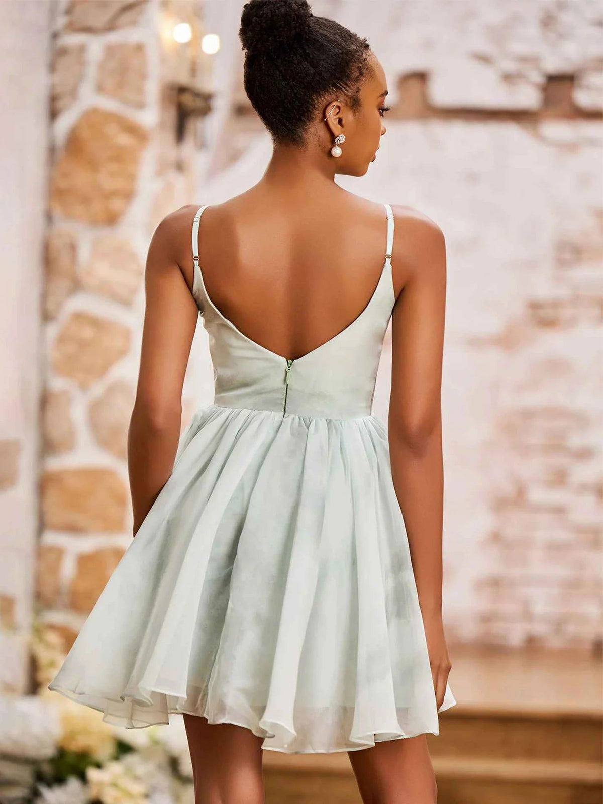 Mint green V-back mini dress with spaghetti straps and flared pleated skirt