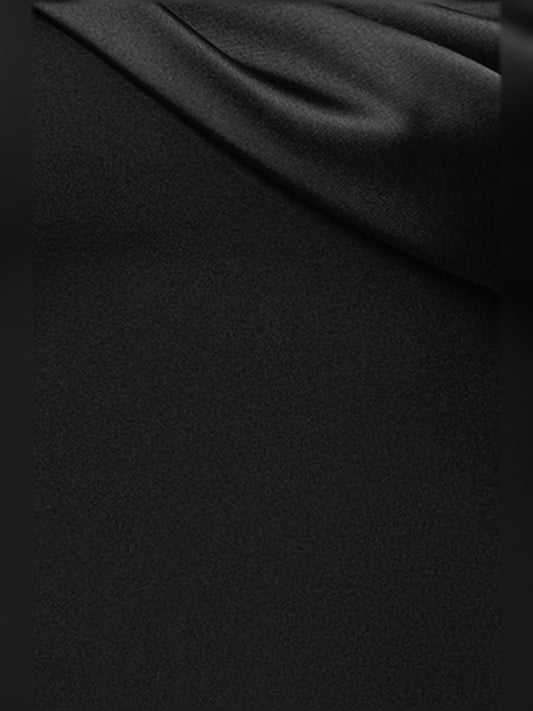 Black satin-like fabric close-up with smooth sheen and diagonal drape folds