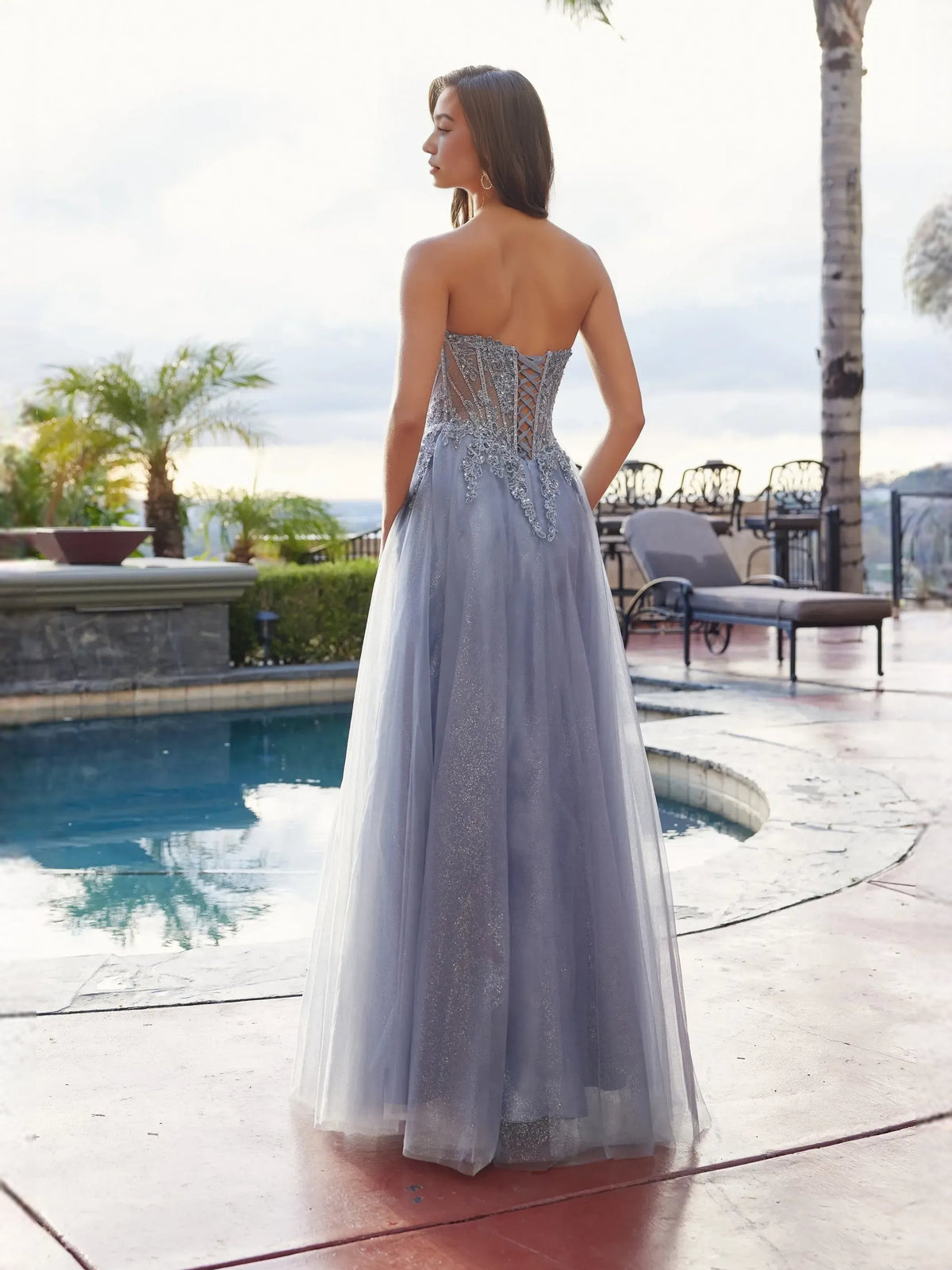 Dusty blue corset prom dress with open back, floral beadwork, front slit tulle skirt