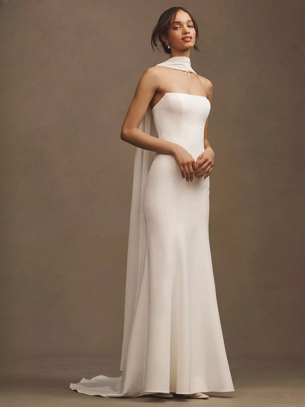 Ivory strapless satin mermaid wedding dress with draped chiffon overlay