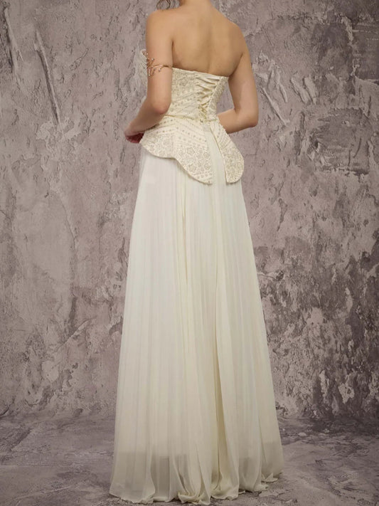 Cream strapless peplum corset A-line formal dress with lace back and pleated chiffon skirt