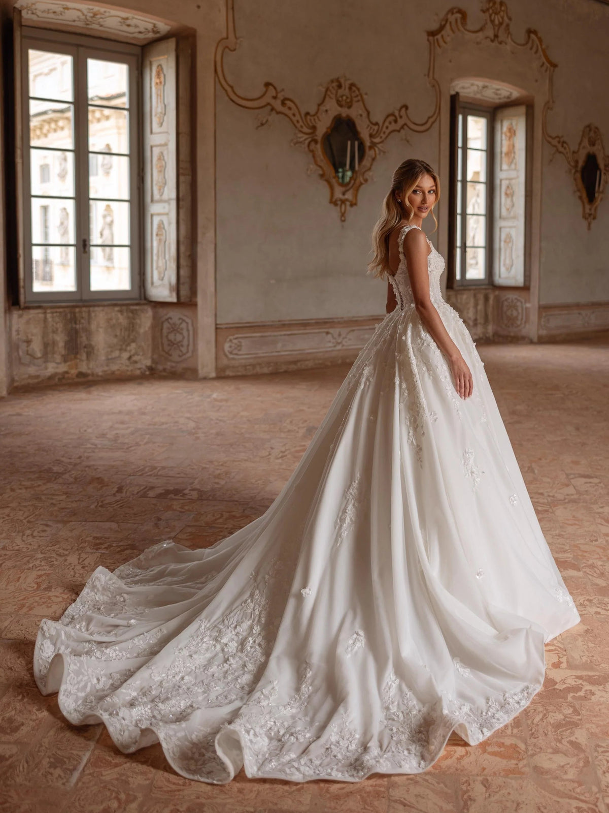 Ivory V-neck ball gown with trailing floral organza skirt and sweeping floor-length train