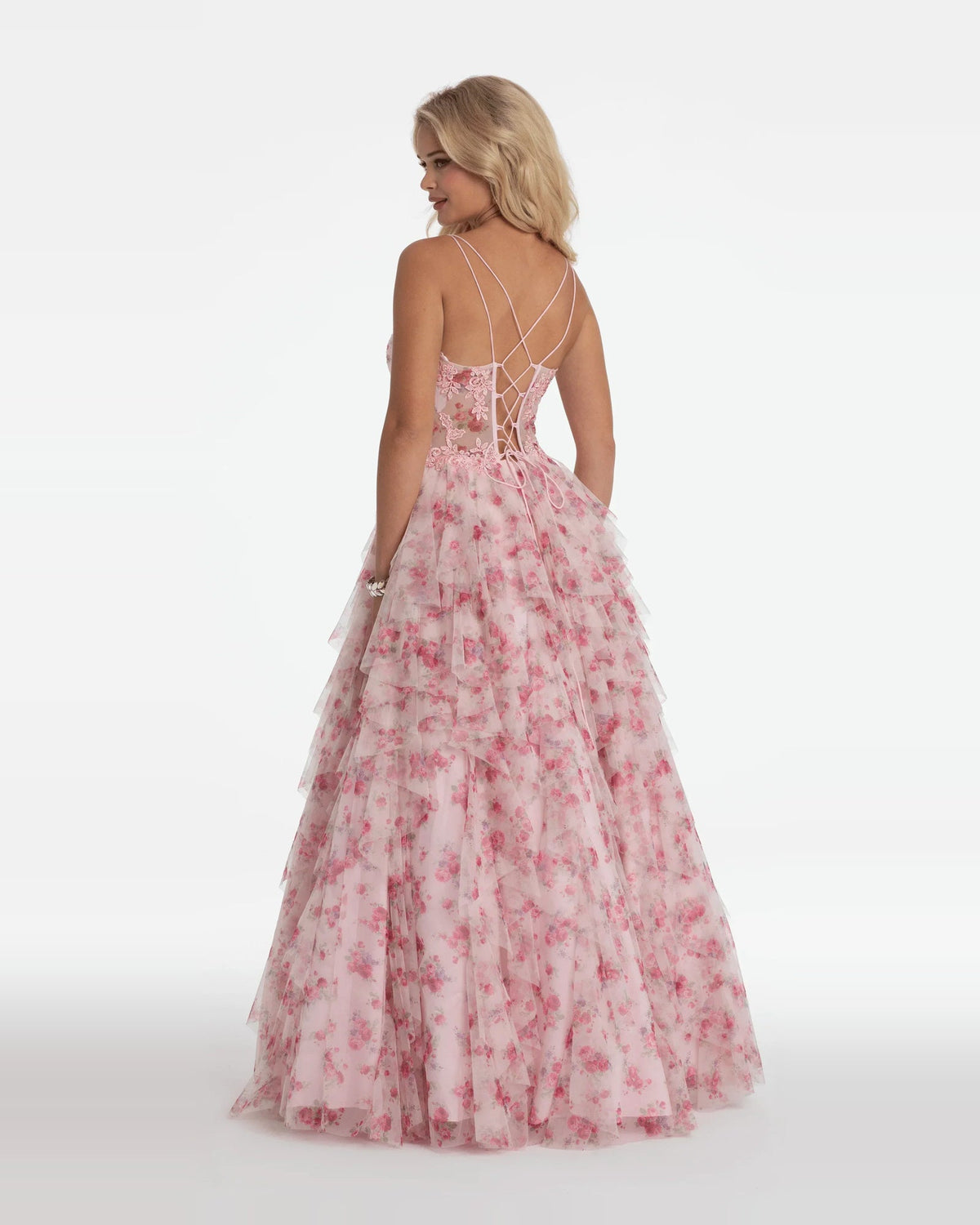 Pink corset sweetheart prom dress with open back, spaghetti straps, and floral tulle skirt