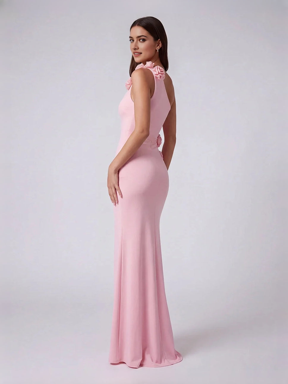 Pink one-shoulder mermaid gown, side view, with floral cut-out shoulder appliques