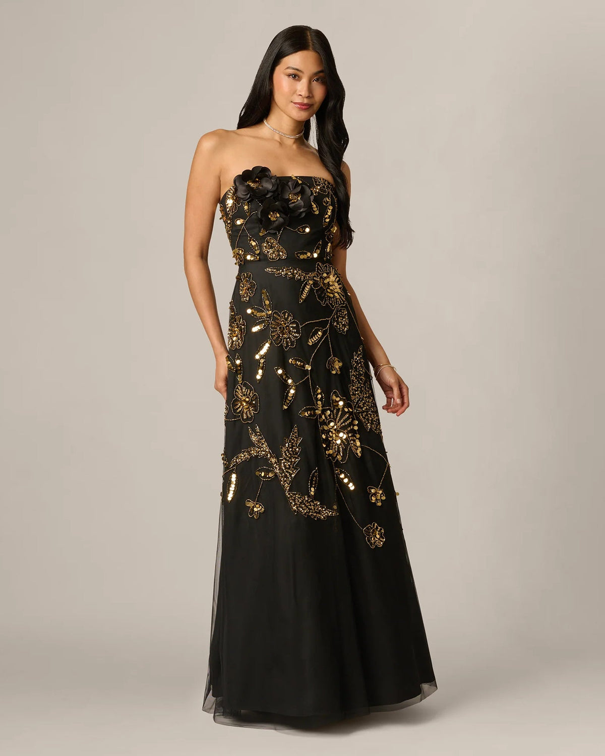 Black strapless A-line maxi dress with gold floral beading, front view