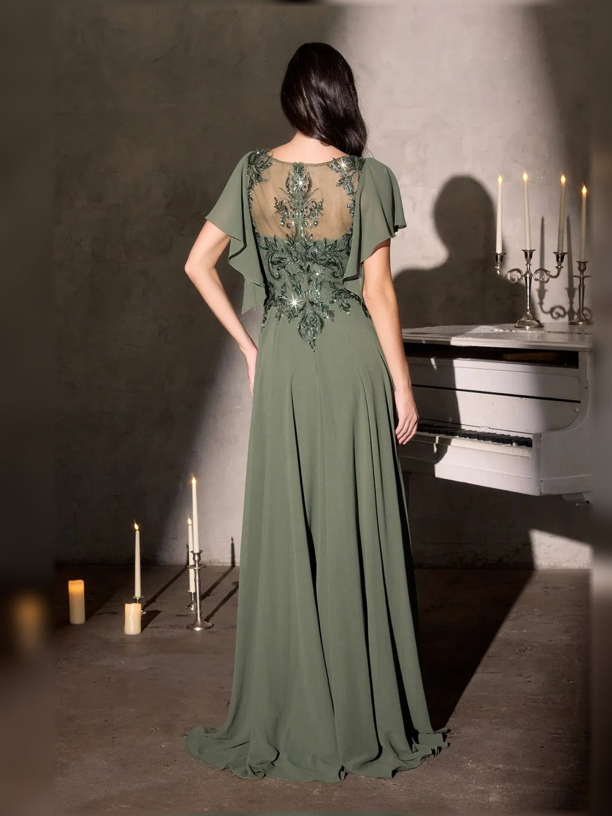 Dusty sage chiffon A-line gown, back view, with beaded neckline and flutter sleeves