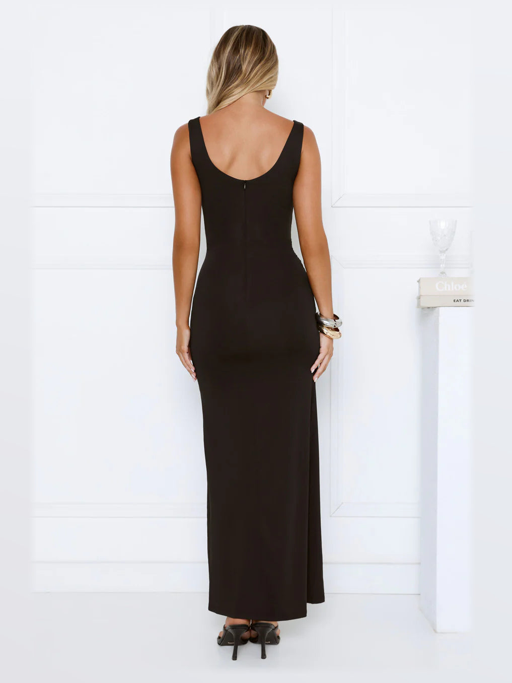 Black maxi formal dress, back full-length view showing the bodice