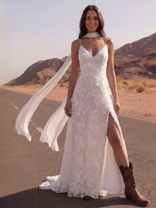 Ivory V-neck A-line wedding dress with floral lace, front slit, and flowing veil
