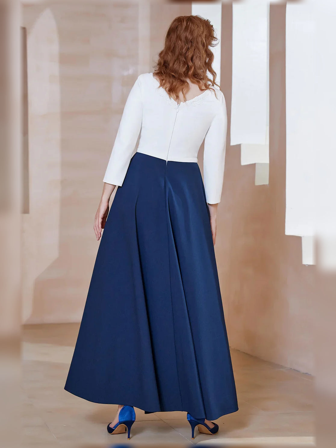 Mother of the bride A-line dress with boat neckline, navy skirt and three-quarter white sleeves
